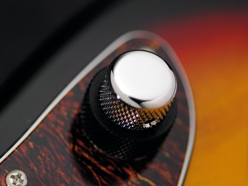 The Jag's chrome knob controls volume.