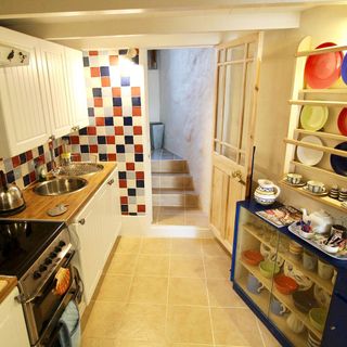 doll house kitchen with checks wall and wooden door
