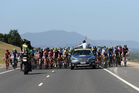 Race director John Trevorrow waves the flag to start the racing