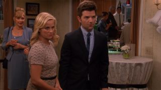 Leslie Knope (Amy Poehler) and Ben Wyatt (Adam Scott) at engagement party in Parks and Recreation
