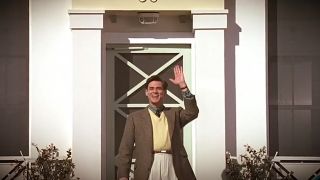 Jim Carrey waving in front of his house in The Truman Show.