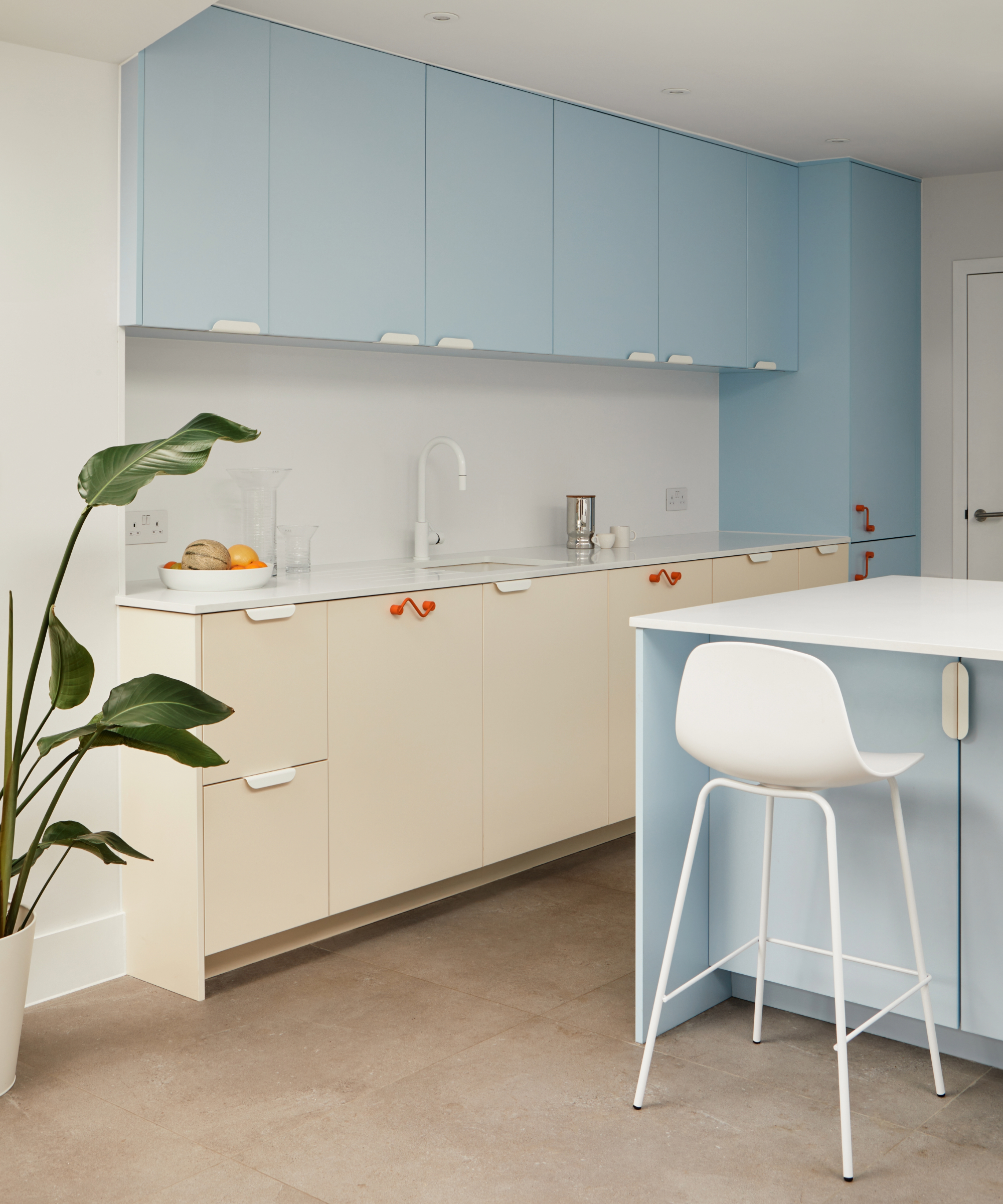 Kitchen with pastel blue and cream cabinets