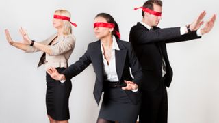 Blindfolded business people