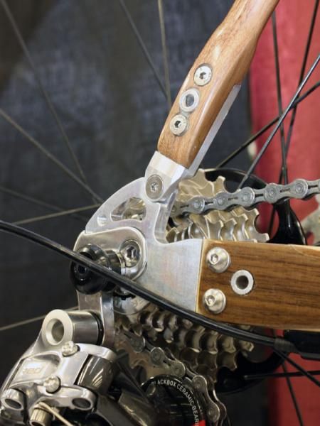 Machined aluminum dropouts are bolted to the ends of the stays.