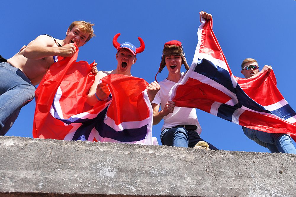Norwegian fans cheer on the riders