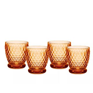 A set of four orange glass tumblers