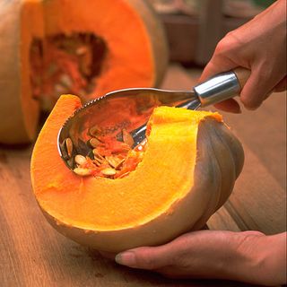 pumpkins with cutter and pumpkin seeds