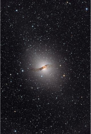The elliptical galaxy NGC 5128, host of the Centaurus A radio source, as it appears in visible light. The galaxy is located about 12 million light-years away and is one of the closest that sports an active supermassive black hole