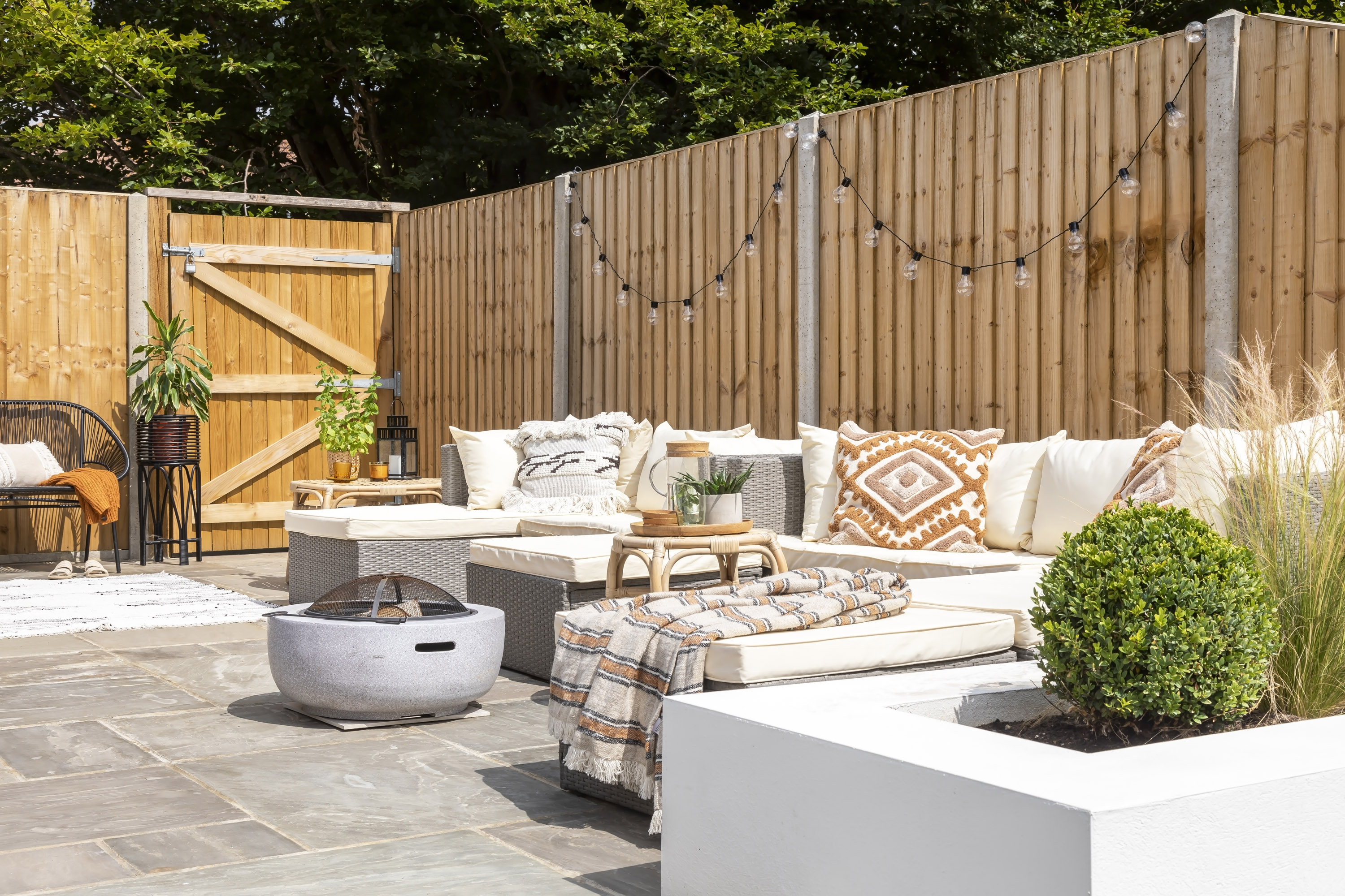 boho outdoor living area in a modern garden