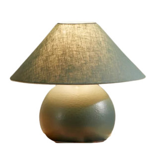 green ceramic table lamp with circular base