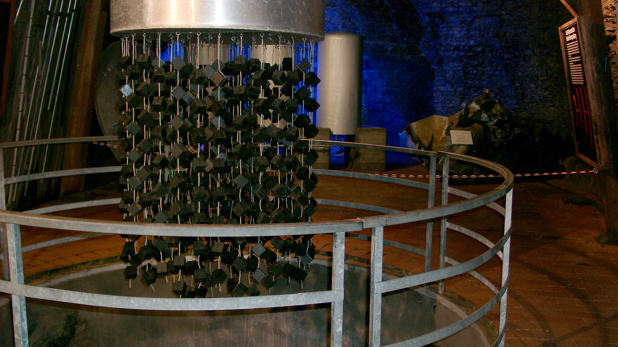 A close up of a nuclear reactor behind metal bars.