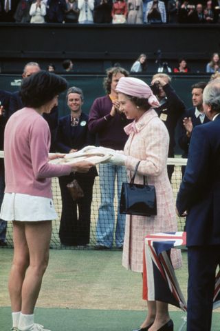 Queen Elizabeth II presenting Virginia Wade with the Wimbledon trophy in 1977