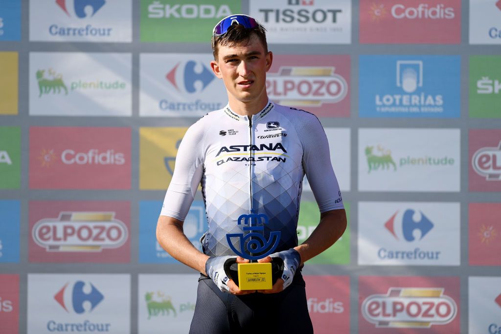 LES PRAERESNAVA SPAIN AUGUST 28 Yevgeniy Fedorov of Kazahkstan and Team Astana Qazaqstan celebrates at podium as best team winner during the 77th Tour of Spain 2022 Stage 9 a 1714km stage from Villaviciosa to Les Praeres Nava 743m LaVuelta22 WorldTour on August 28 2022 in Les Praeres Nava Spain Photo by Justin SetterfieldGetty Images