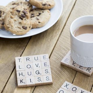 cookies cup of tea letter blocks on wooden table