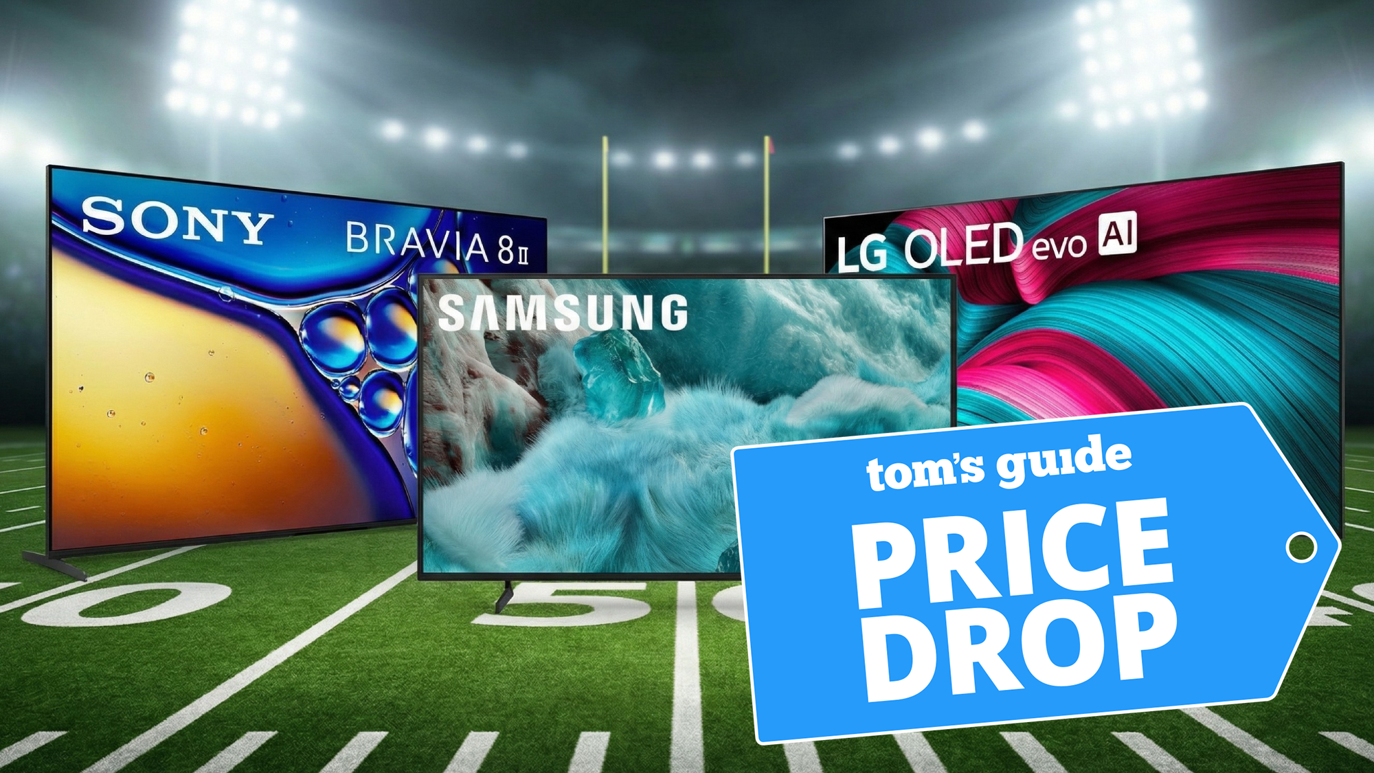 Three over-sized TVs show on a football field