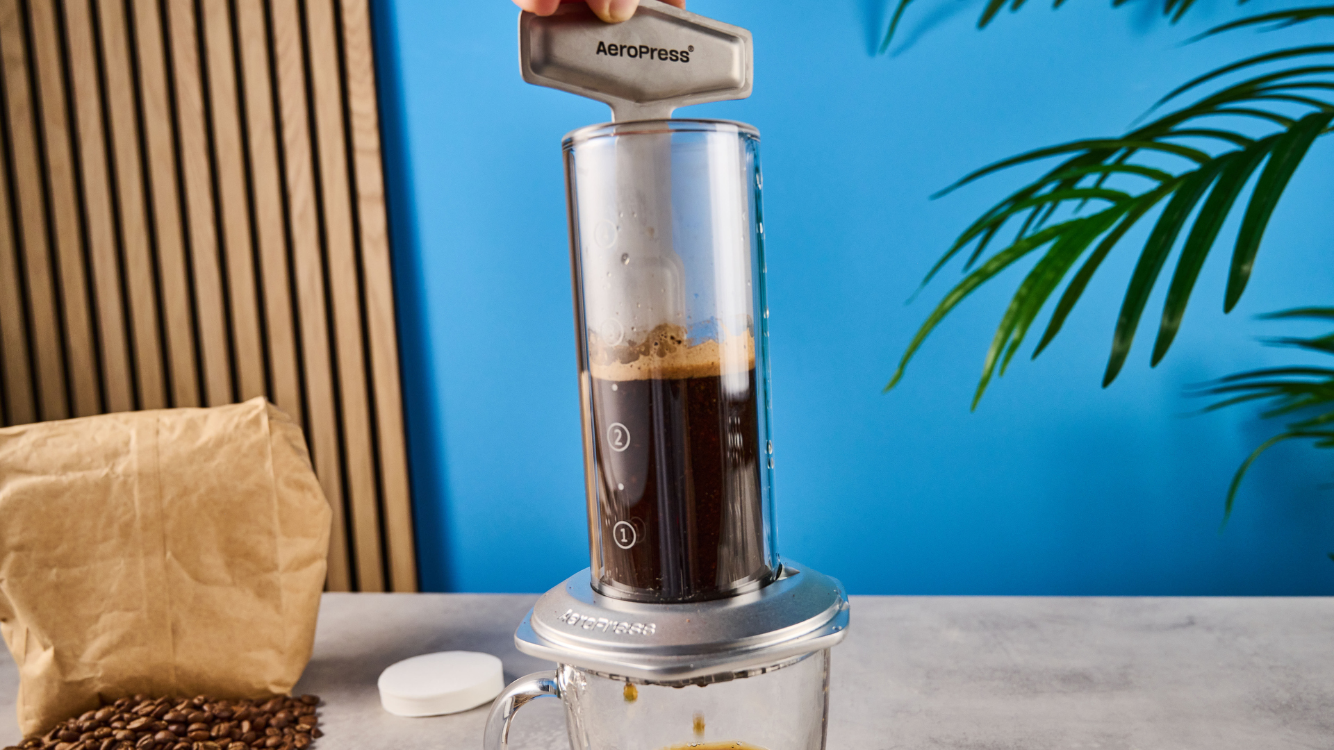 a glass AeroPress premium with aluminum flourishes 