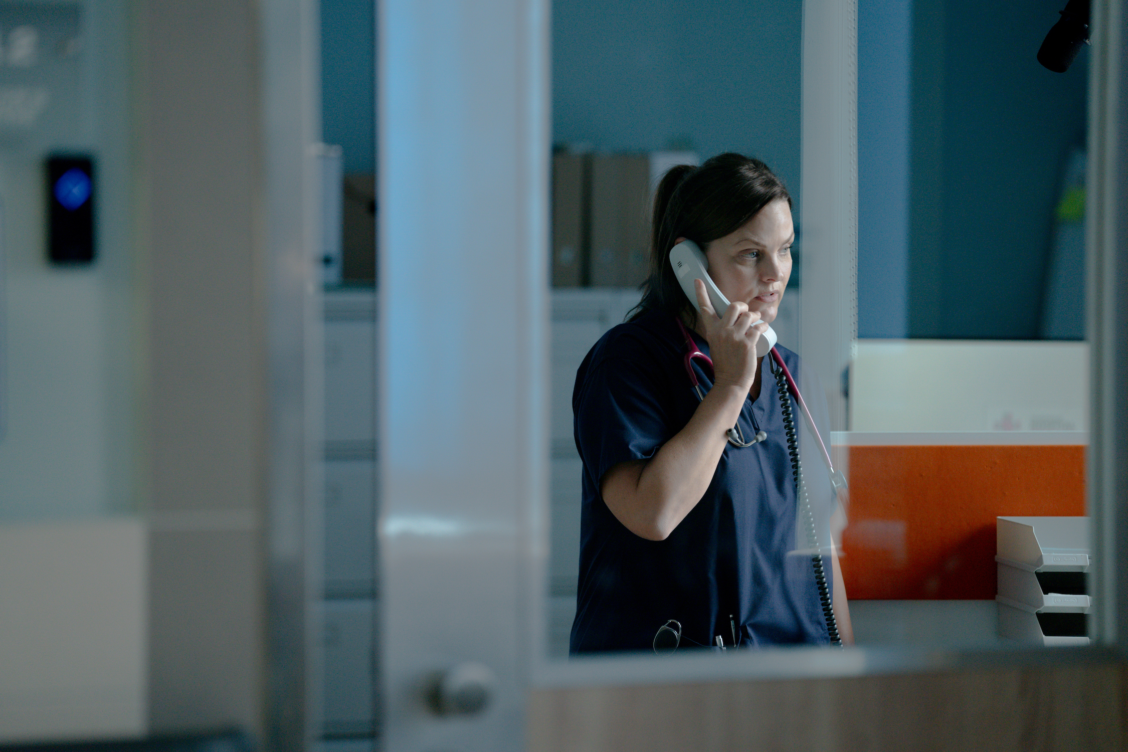 Liz on the phone to social services.
