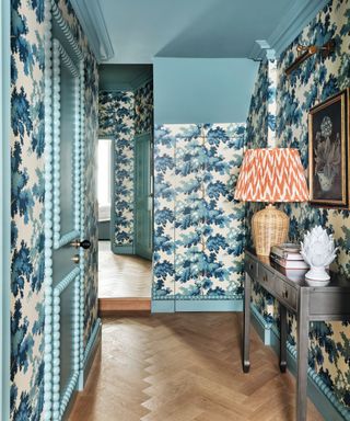 hallway with botanical blue wallpaper