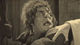 Lon Chaney with an angry expression on his face as Quasimodo in The Hunchback of Notre Dame