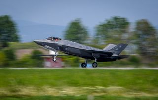 A U.S. Air Force F-35A Lightning II pilot assigned to the 34th Fighter Squadron, based at Hill Air Force Base, Utah, completes pre-flight checks prior to departing RAF Lakenheath, England on May 7, 2017.