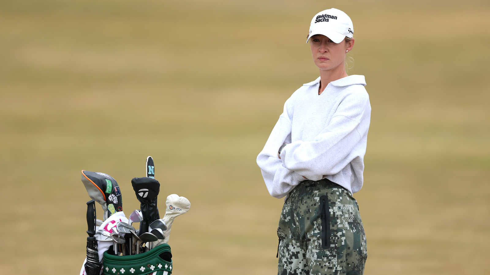 Nelly Korda waits by her golf bag