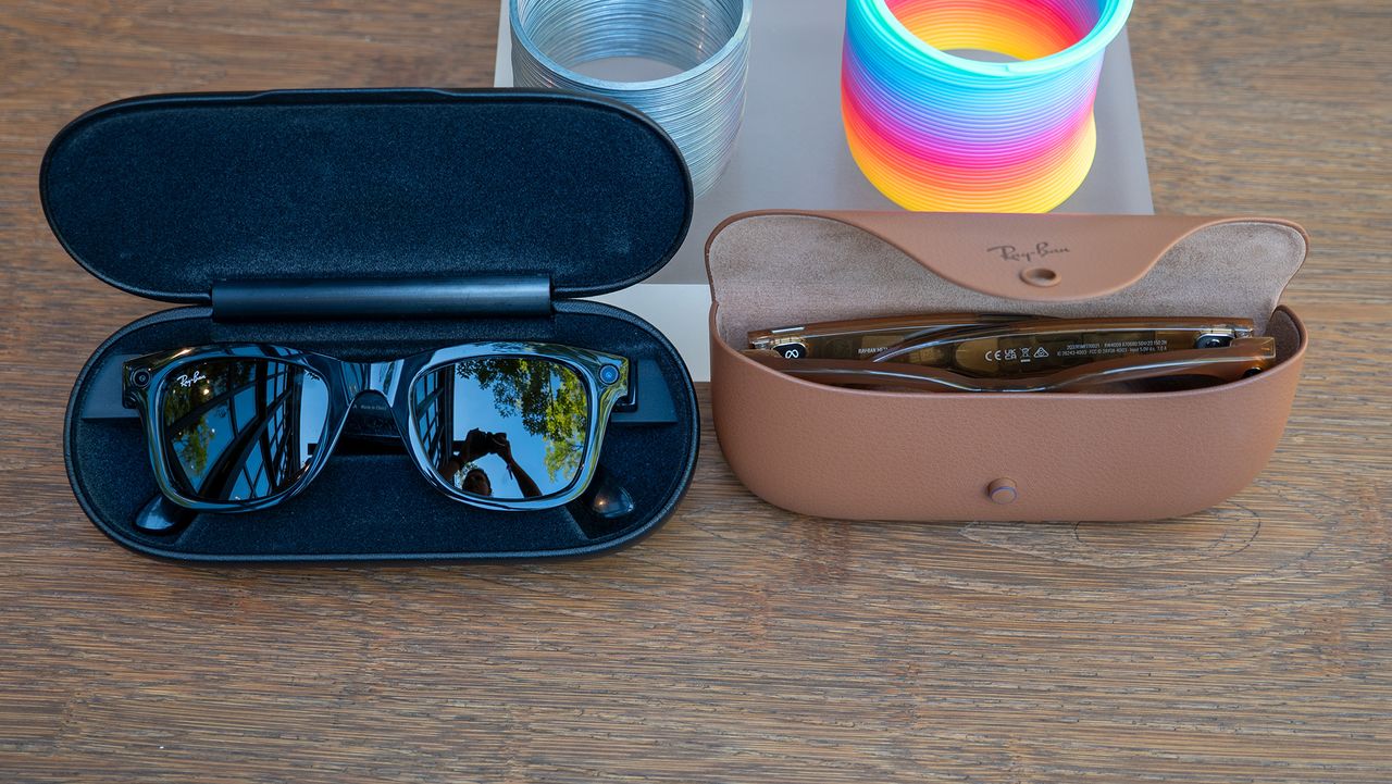 Comparing Ray-Ban Meta smart glasses in the new tan charging case with Ray-Ban Stories in its larger black charging case