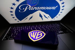 Paramount logo displayed on a laptop screen and Warner Bros logo displayed on a phone screen are seen in this illustration photo taken in Krakow, Poland on February 28, 2026. (Photo by Jakub Porzycki/NurPhoto)