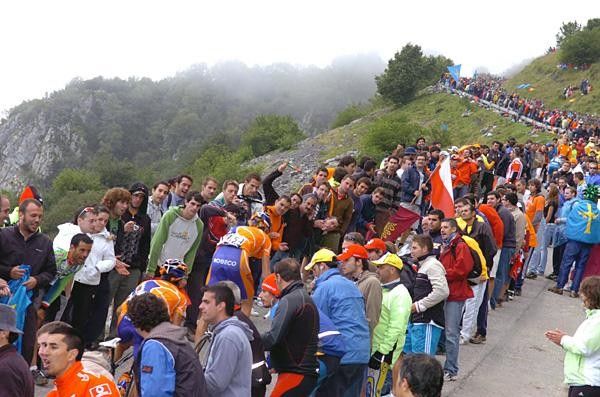 Fans greet the riders.