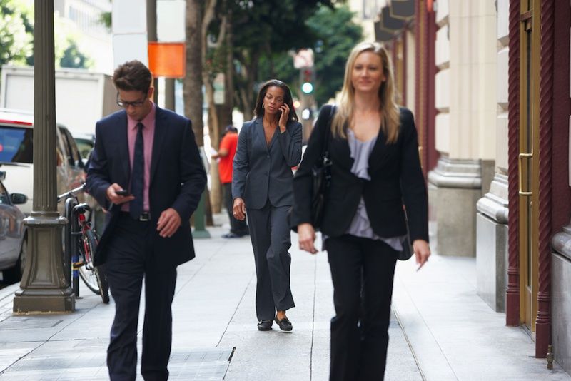 man texting while walking