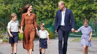 Prince George, Kate Middleton, Prince Louis, Prince William and Princess Charlotte walk hand-in-hand as they arrive for a settling in afternoon at Lambrook School, near Ascot on September 7, 2022 in Bracknell, England