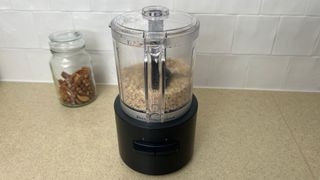 The KitchenAid Go Cordless Food Chopper chopping nuts