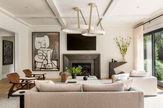 a living room with a large asymmetric piece of wall art