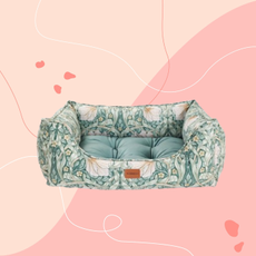 Morris & Co pimpernell pet bed on pink background.