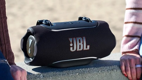 JBL Xtreme 5 Bluetooth speaker in black on a wall 