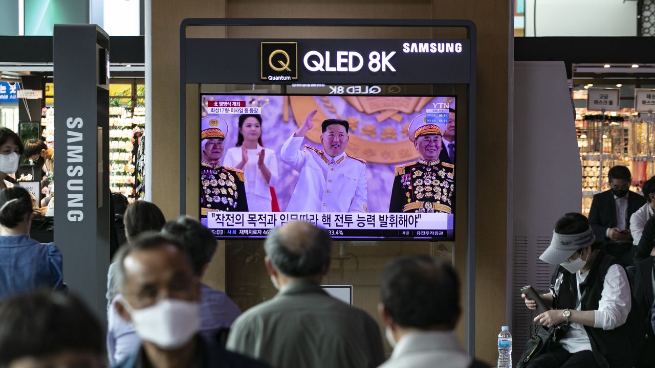 A news broadcast of the military parade in Pyongyang, North Korea