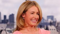 A HEADSHOT OF CAT DEELEY