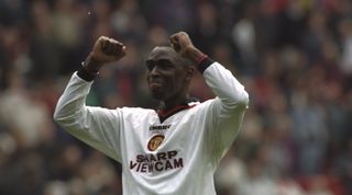 19 Apr 1997: Andy Cole of Manchester United raises his arms in triumph after victory against Liverpool in the Premier League match at Anfield in Liverpool, England. Manchester United won 3-1. \ Mandatory Credit: Ross Kinnaird /Allsport