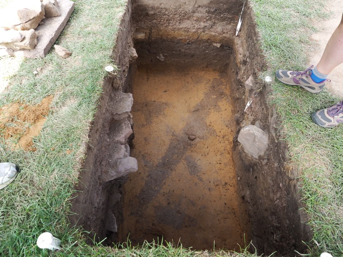 Archaeologists have found the traces of posts and a wooden palisade (the diagonal mark from lower left to upper right) that date from around the time of the Pequot attack in 1637.