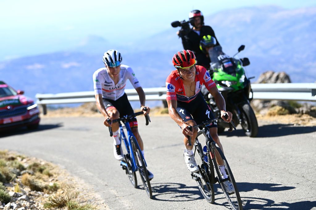 SIERRA DE LA PANDERA SPAIN SEPTEMBER 03 LR Juan Ayuso Pesquera of Spain and UAE Team Emirates White Best Young Rider Jersey and Remco Evenepoel of Belgium and Team QuickStep Alpha Vinyl Red Leader Jersey compete during the 77th Tour of Spain 2022 Stage 14 a 1603km stage from Montoro to Sierra de La Pandera 1815m LaVuelta22 WorldTour on September 03 2022 in Sierra de La Pandera Spain Photo by Tim de WaeleGetty Images