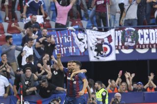 Levante’s players and fans celebrate their third goal during Saturday's shock win against Barcelona