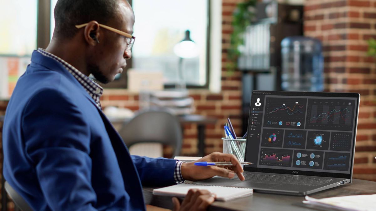 Man looking at graphs on an Acer Chromebook Spin 714 