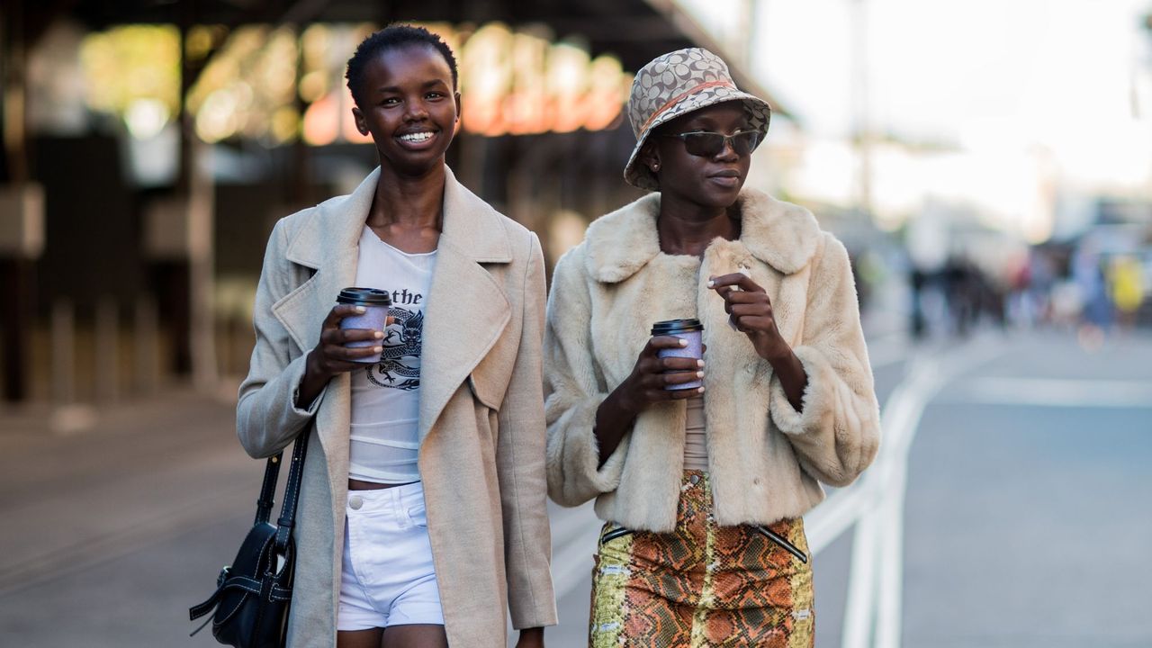 Two women photographed in the street at fashion week