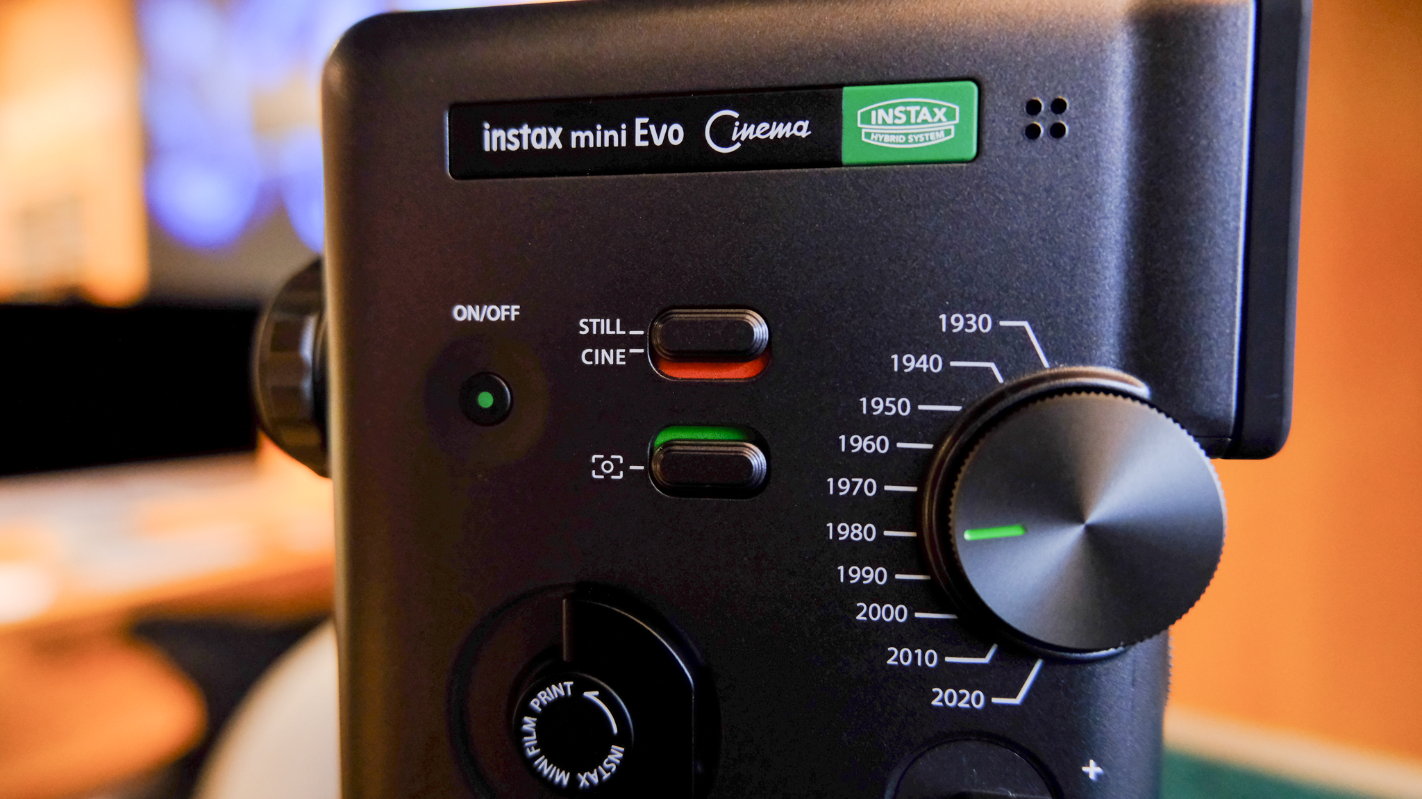 A black Fujifilm Instax mini Evo Cinema hybrid instant camera