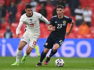 Billy Gilmour of Scotland is challenged by Mason Mount of England during the UEFA Euro 2020 Championship Group D match between England and Scotland at Wembley Stadium on June 18, 2021 in London, England. (Photo by Shaun Botterill - UEFA/UEFA via Getty Images) Euro 2024