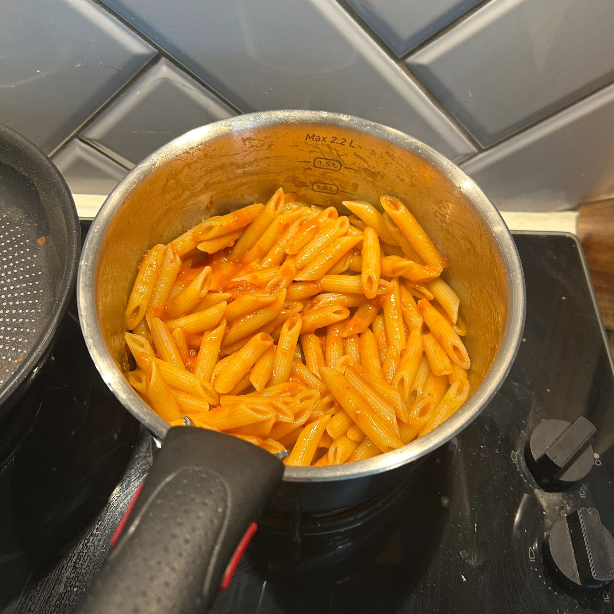 Tefal Ingenio Emotion 22-Piece Pan Set - saucepan cooking pasta in sauce