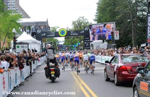 The riders head through the start-finish