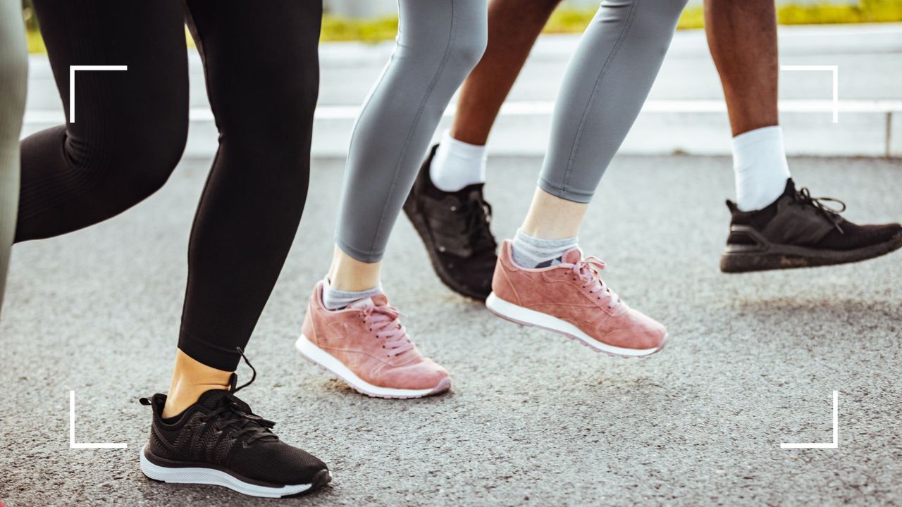 Women&#039;s feet in running trainers along gravel path, walking for weight loss