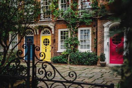 An exterior shot of charming row homes in Notting Hill