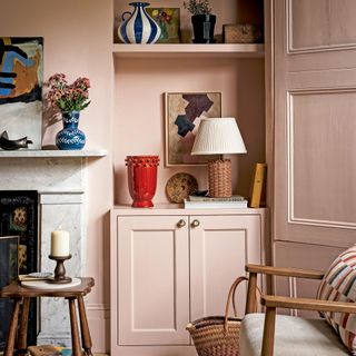 Pink living room with dark wood furniture