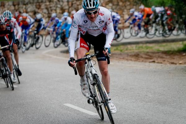 A rider from Omega Pharma-Lotto attacking the peloton at the foot of the last mountain.